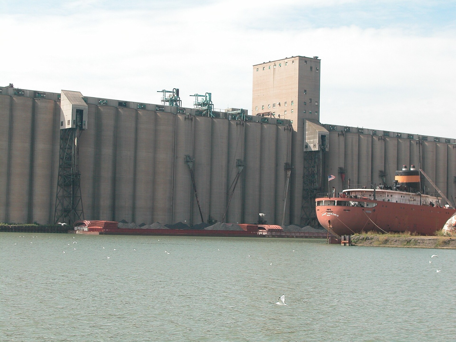 A grain elevator and a freighter on Lake Calumet
